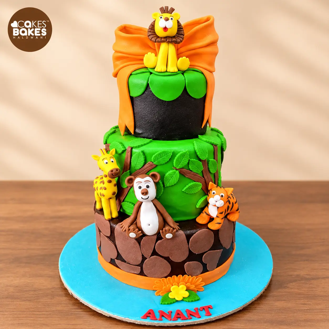 Colourful Jungle Safari Tiered Cake — 100% eggless cake by Cakes & Bakes Haldwani