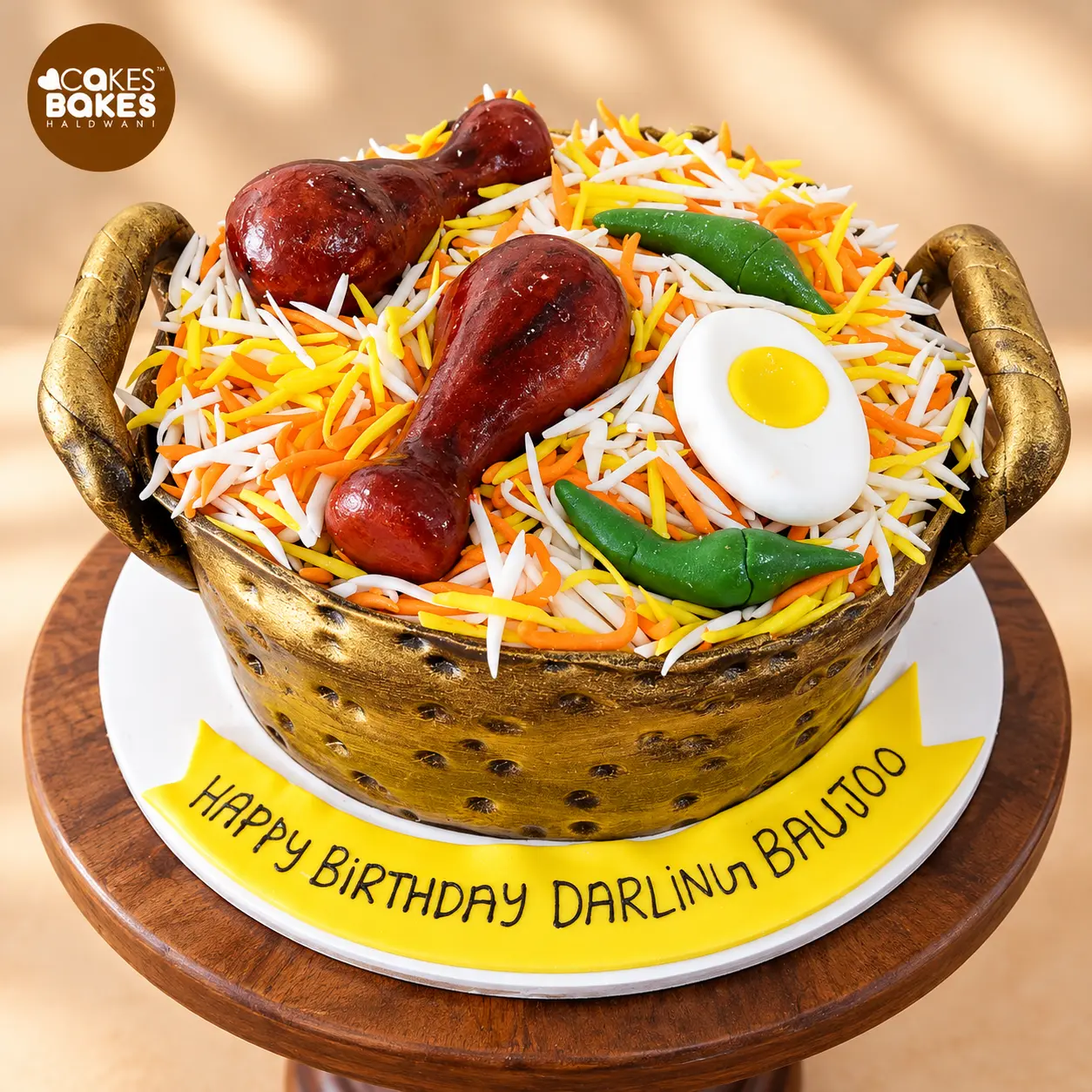 Biryani-Inspired Birthday Cake on Wooden Stand — 100% eggless cake by Cakes & Bakes Haldwani